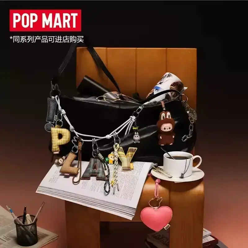 Pop mart kpop demon hunters merch necklace keychain display with letter charms and plush toys.