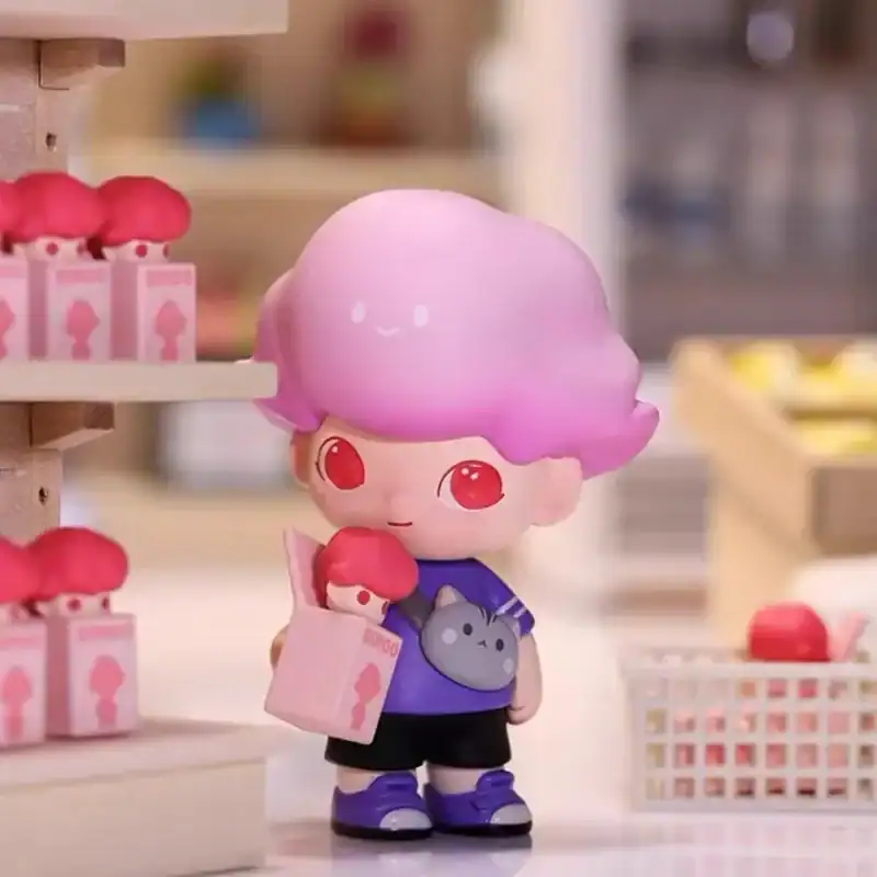 Cute K-pop Demon Hunters merch plush toy with pink hair and red eyes.