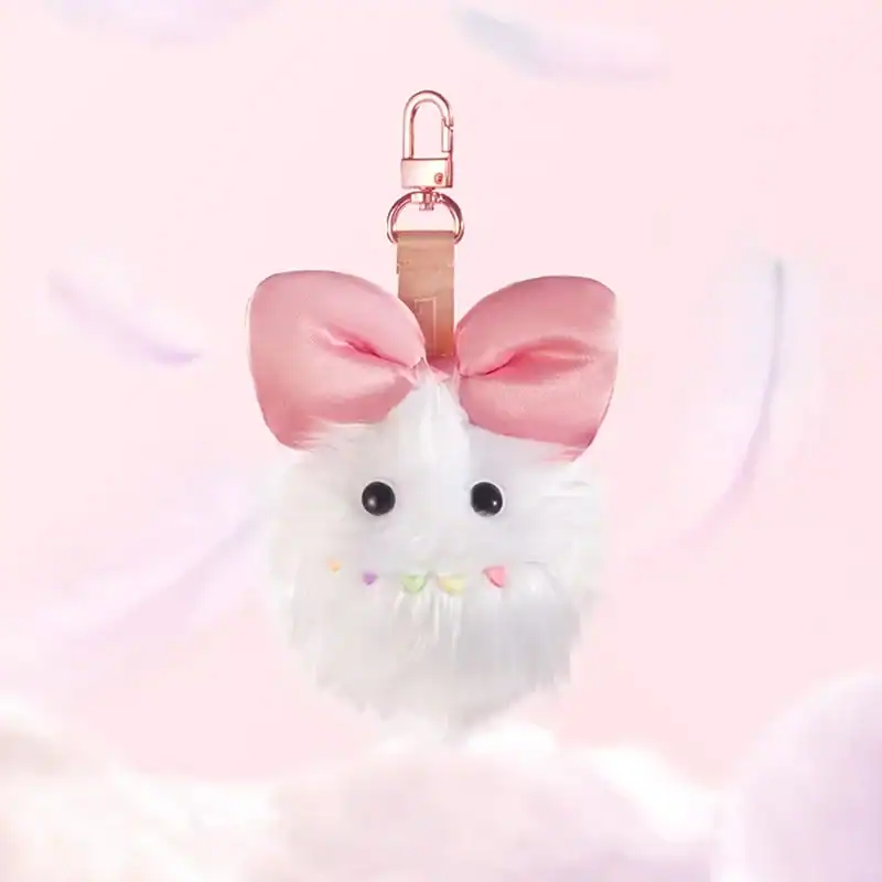 Kpop demon hunters merch keychain with cute fluffy animal design and pink bow.